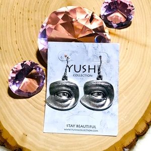 Yuchi Collection eye drop earrings.